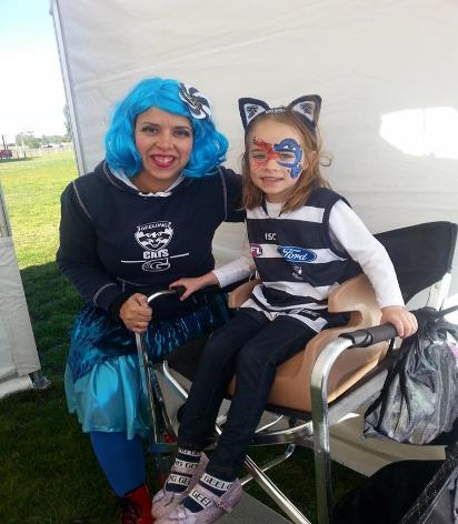 Image may contain: 2 people, people smiling, people sitting and outdoor